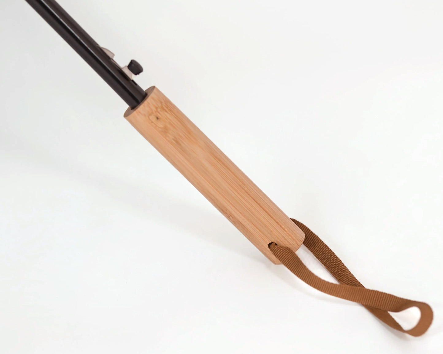 bamboo handle with a brown strap on a white background