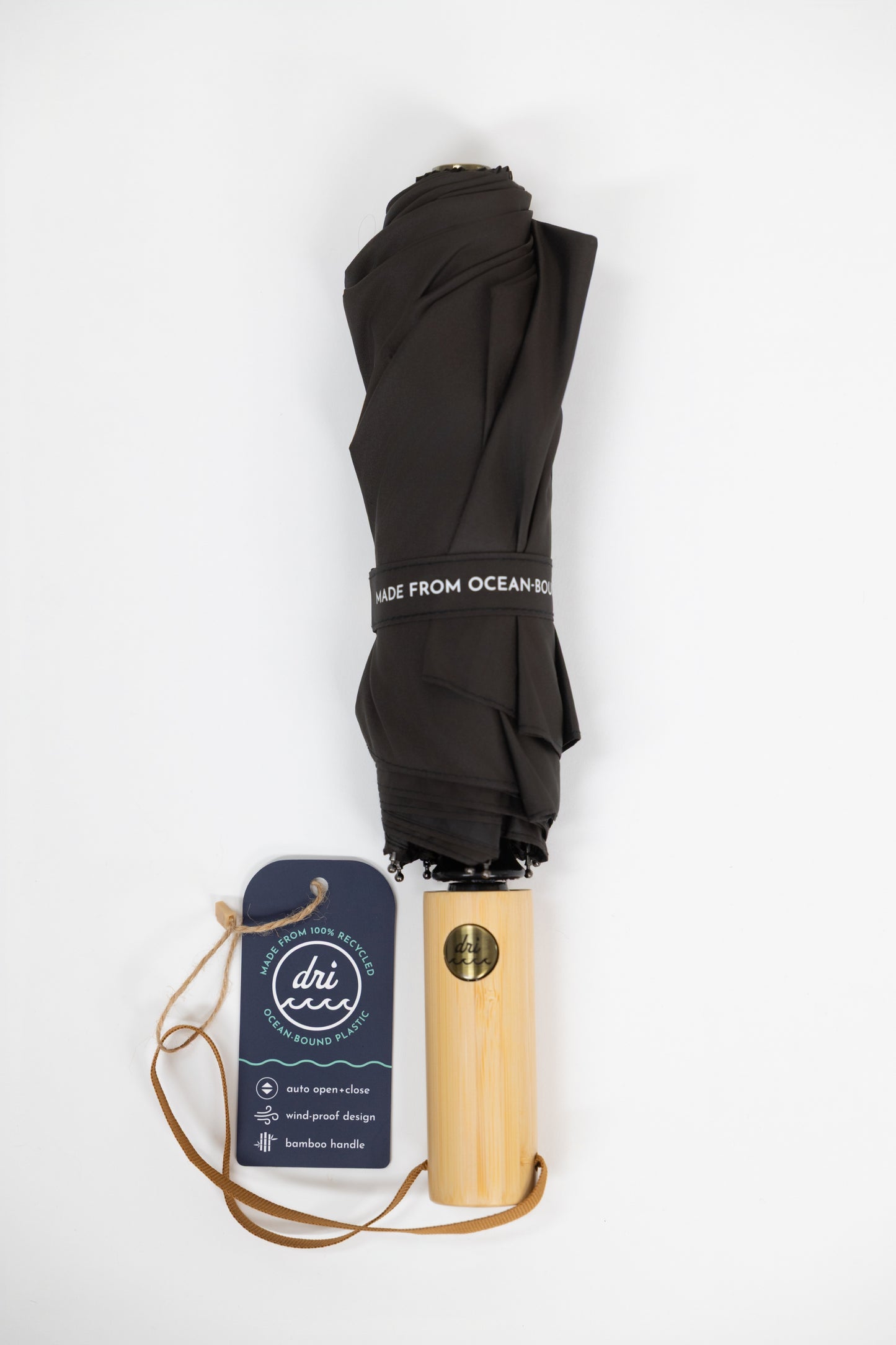 Black umbrella with bamboo handle and 'dri umbrella' branding on a white background