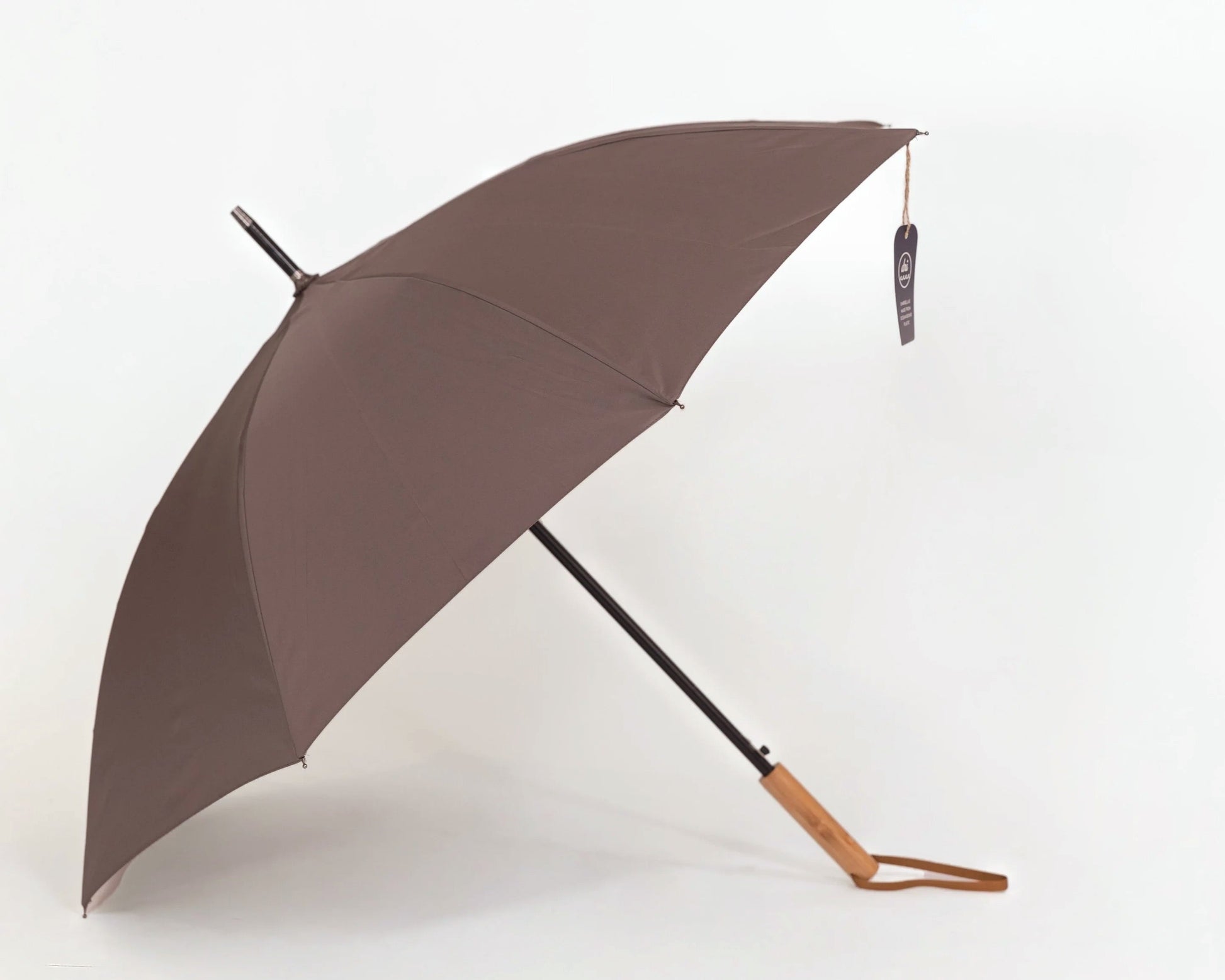 Brown umbrella with bamboo handle on a white background