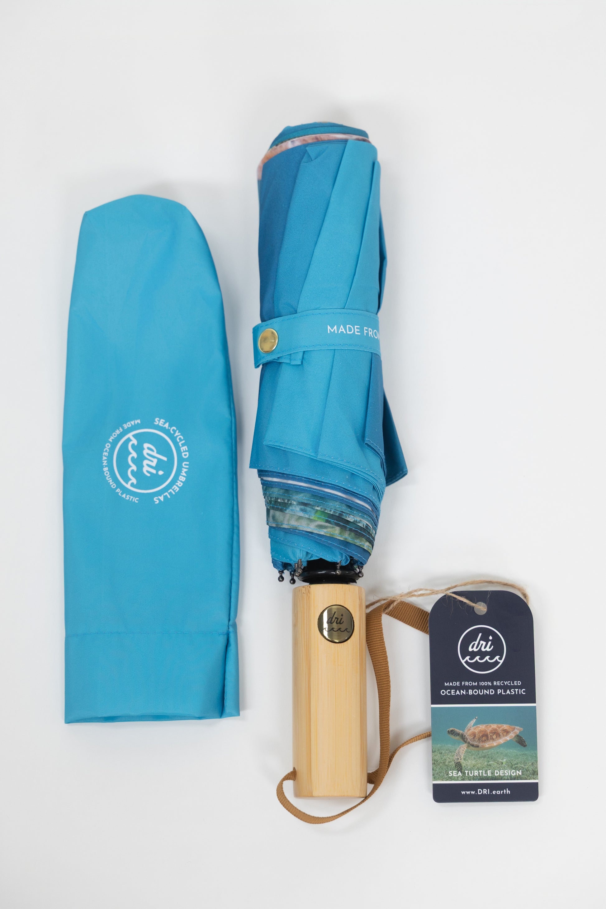 Blue umbrella with wooden handle and packaging on a white background